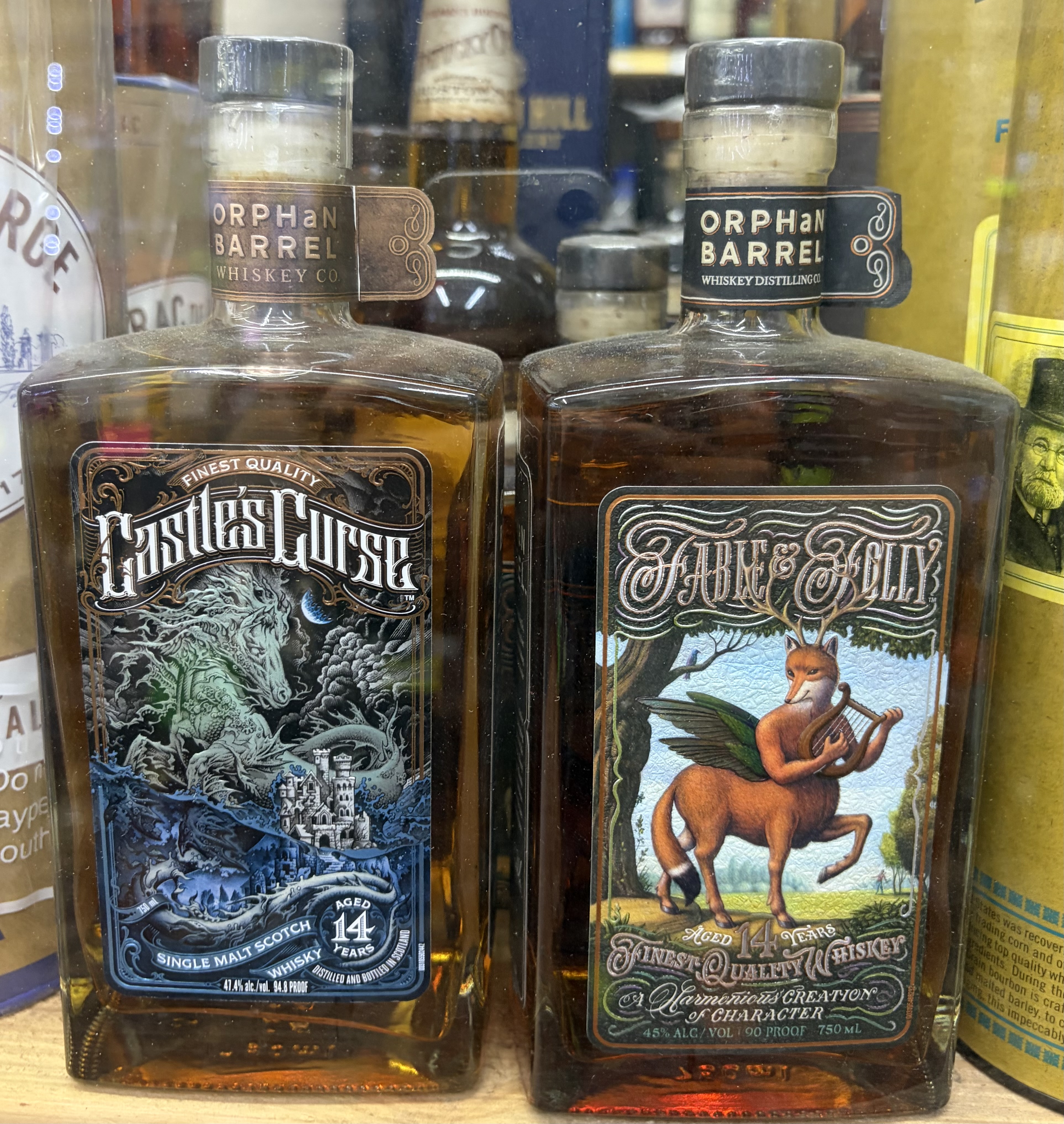 Orphan Barrel Castle's Curse 14-Year Single Malt Scotch and Fable & Folly 14-Year whiskey bottles.