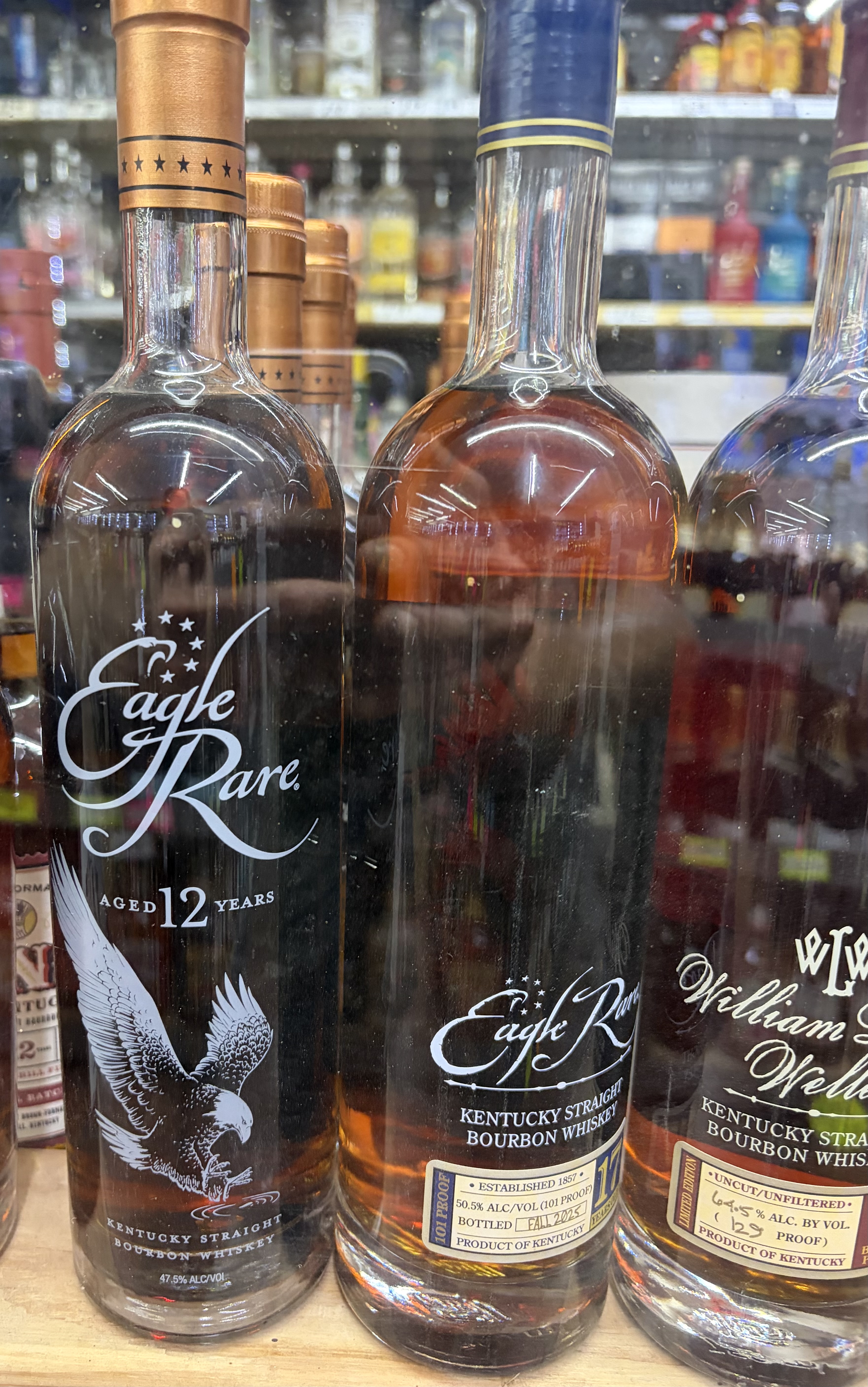 Eagle Rare Aged 12 Years and Eagle Rare 17-Year Kentucky Straight Bourbon beside William Larue Weller.