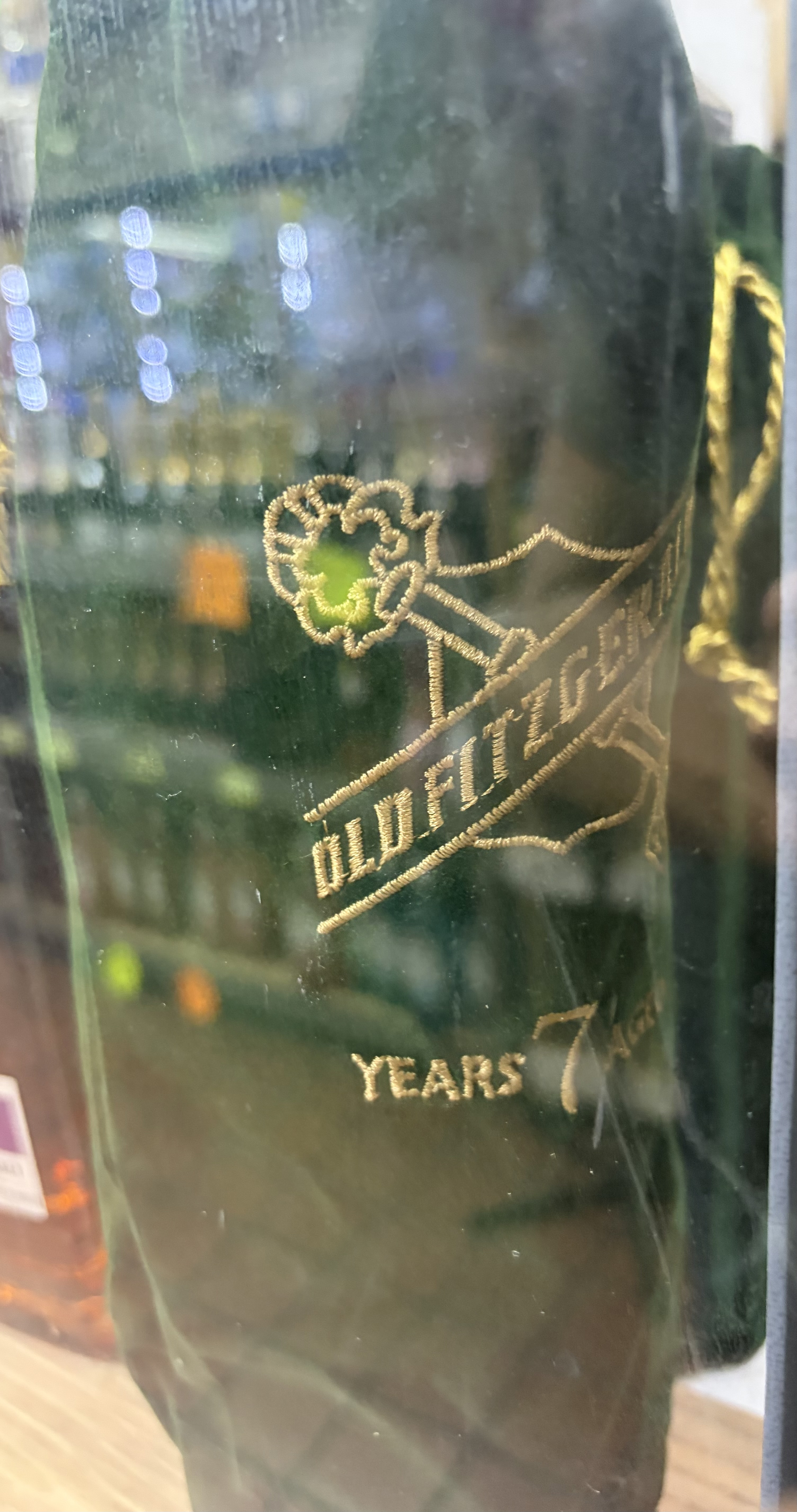 Old Fitzgerald 7-year bottle in its green velvet bag.