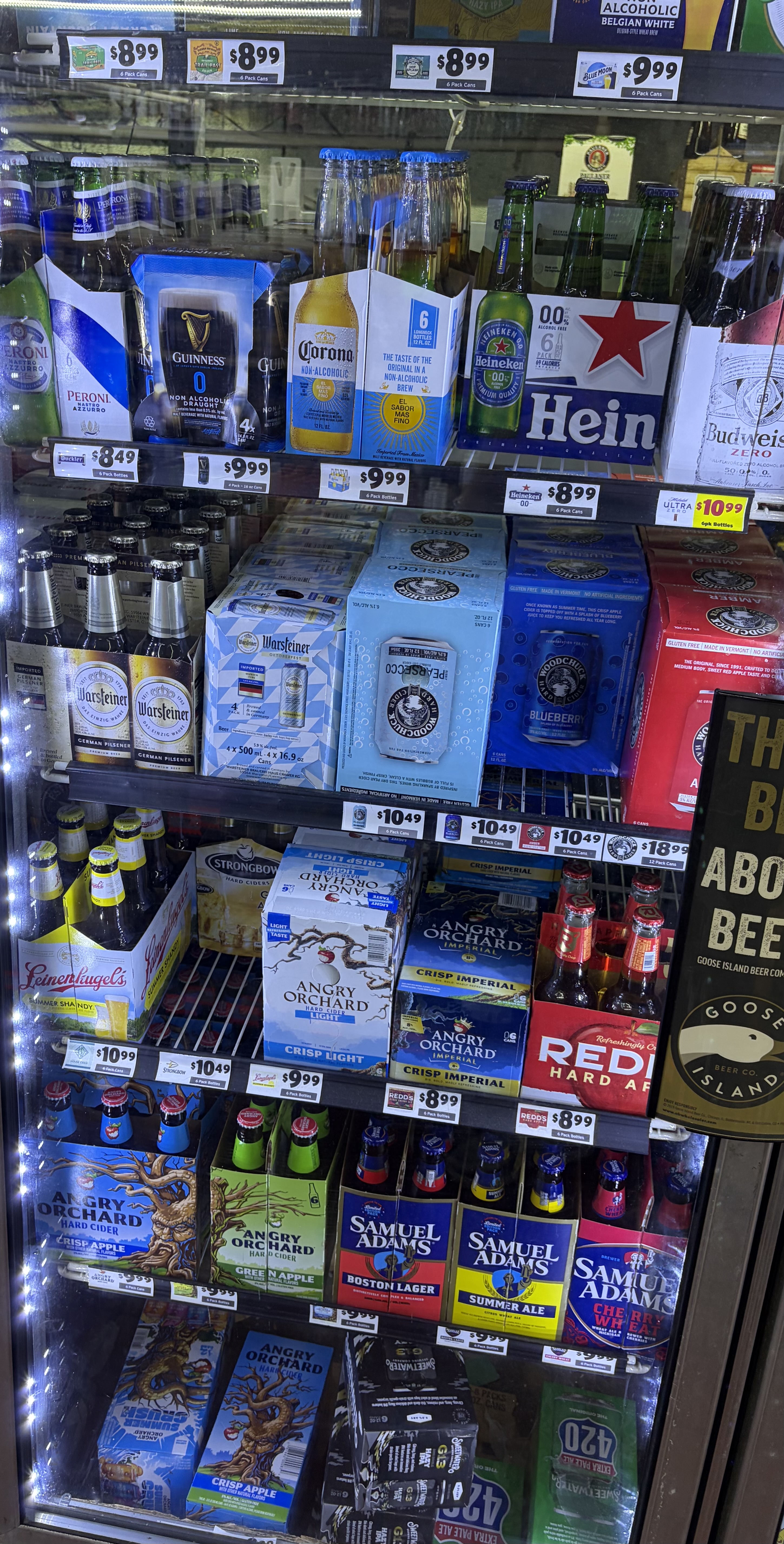 Six-packs of Peroni, Warsteiner, Angry Orchard cider and Samuel Adams.