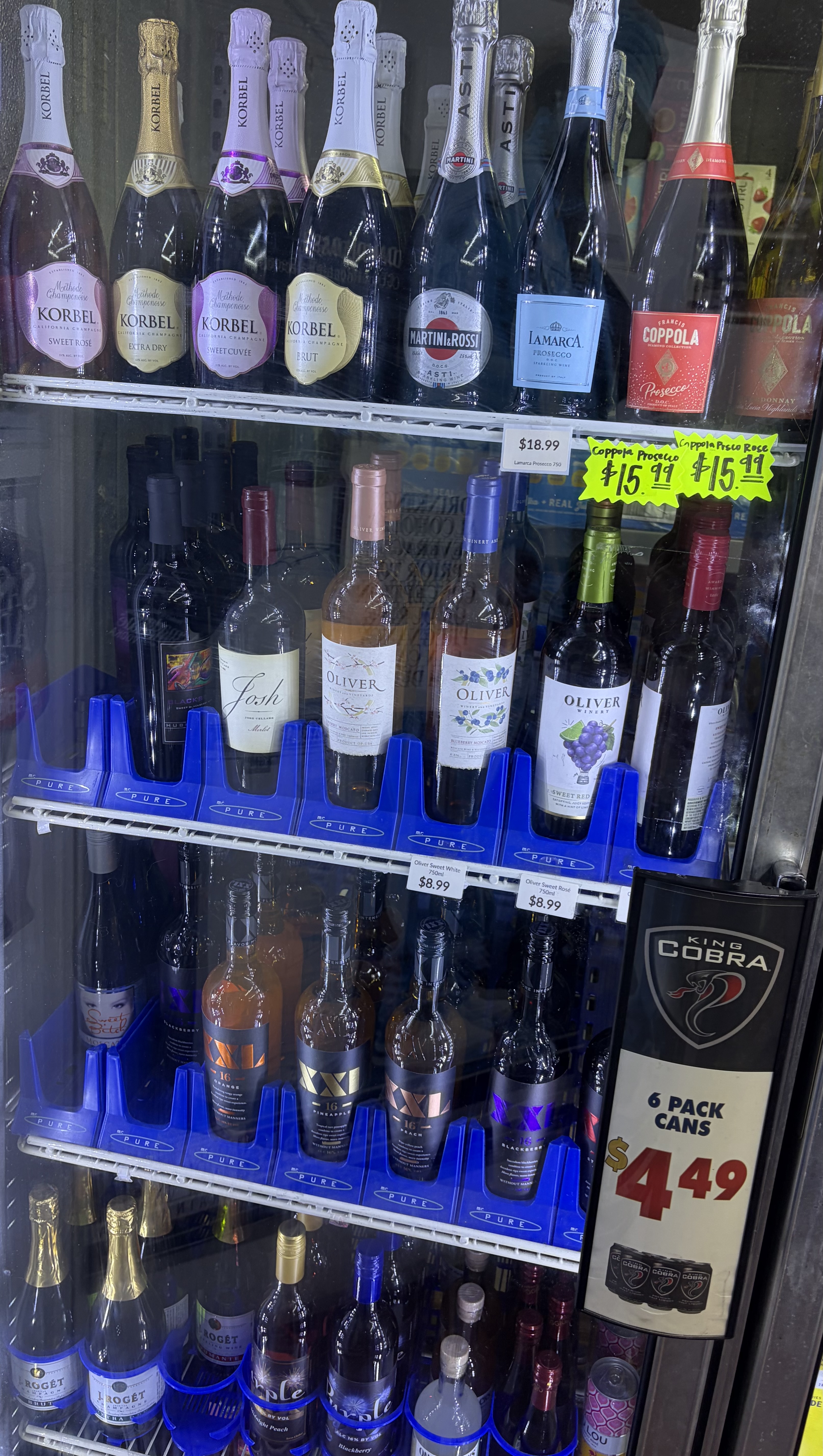 Refrigerated wine including Korbel, La Marca Prosecco, Josh and Oliver bottles.