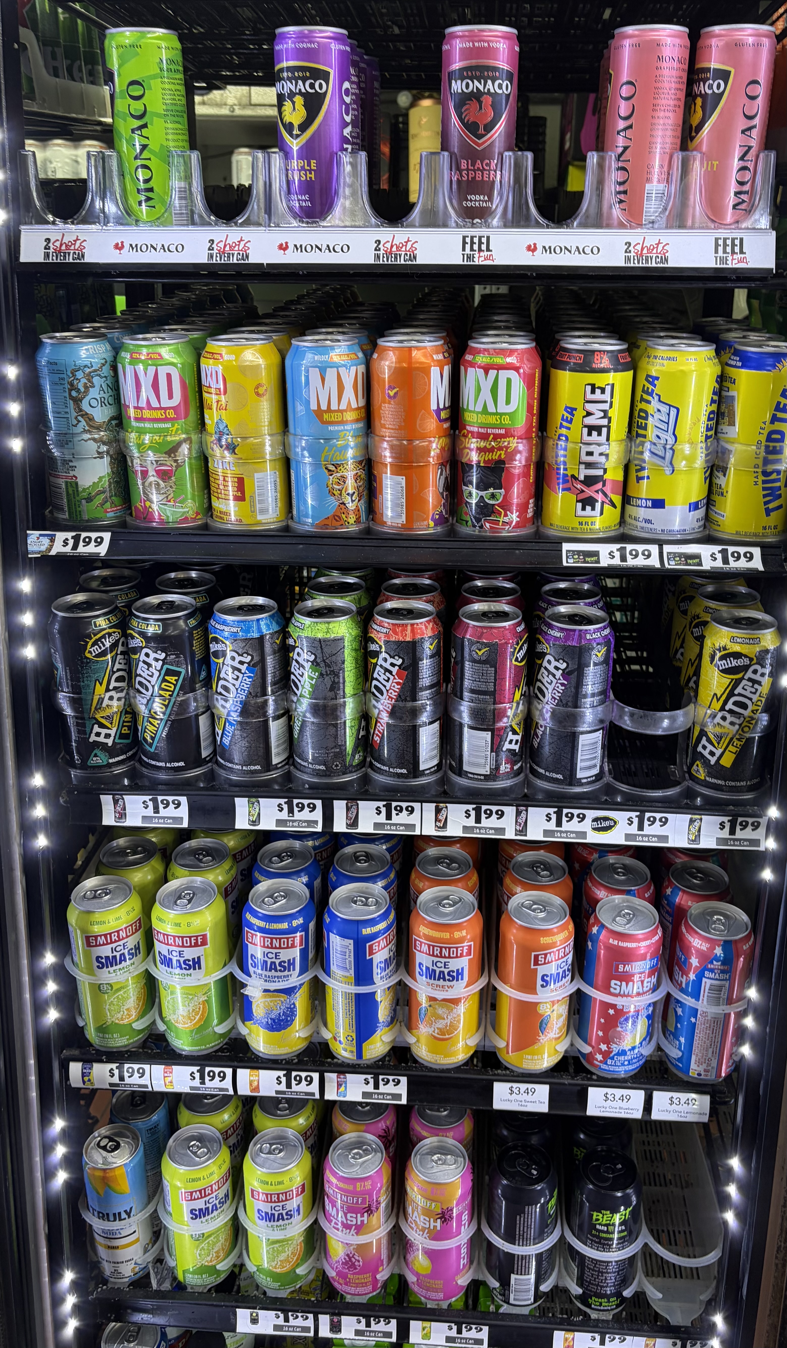 Single-serve cans of Monaco, MXD, Mike's Harder and Smirnoff Ice.