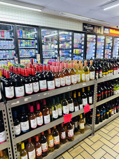 Wine wall and cold cases inside J.R. Liquors